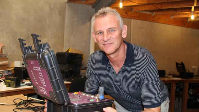 Trident RFID CEO Philip Almond works on a timing device at the Clontarf workshop. Photo: Erin Smith.