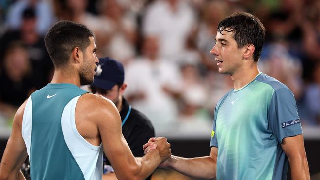 Spain's Carlos Alcaraz shakes hands with Kazakhstan's Alexander Shevchenko after first round match at the Australian Open. (Photo by Martin KEEP / AFP)