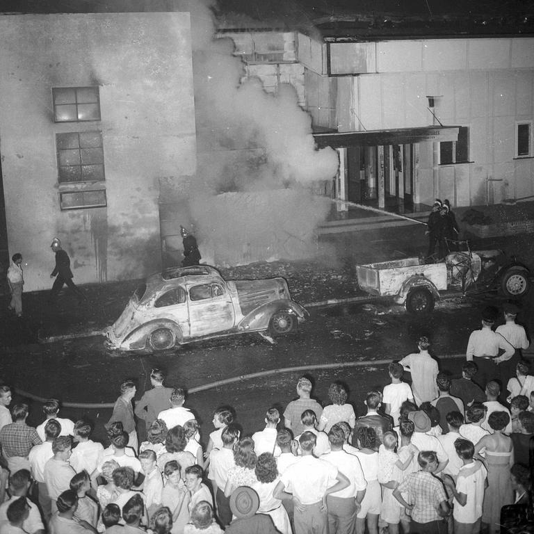 40,000 people crammed into South Brisbane to watch firemen battling a blaze which burnt out the old Cremorne Theatre in 1950. Picture: Harry Freeman