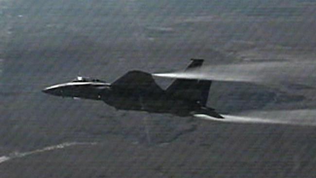 USAF General Chuck Yeager breaks the sound barrier again during a flight in an F-15 jet over Edwards Air Force base on October 14, 1997, during the 50th anniversary re-enactment of his 1947 flight where he flew at the speed of sound.