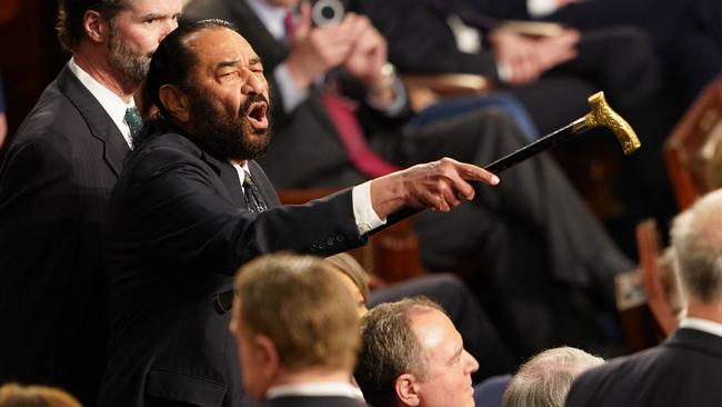 US Representative Al Green (D-TX) (L) disrupts US President Donald Trump  as he addressed to a joint session of Congress at the US Capitol in Washington, DC, on March 4, 2025. (Photo by ALLISON ROBBERT / AFP)