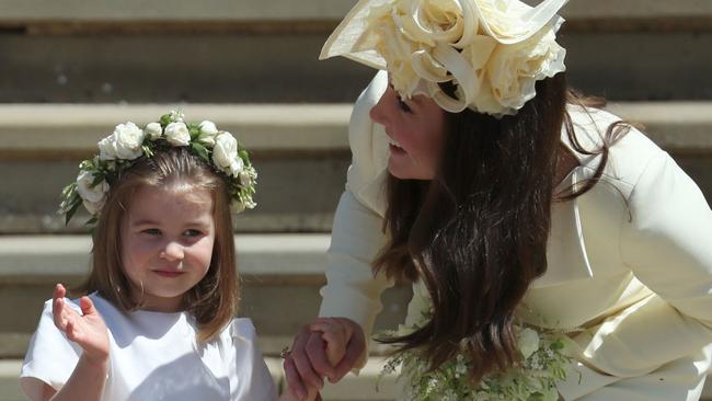 Princess Charlotte with Catherine, Duchess of Cambridge at Meghan and Harry’s 2018 wedding. Picture: AFP / Jane Barlow