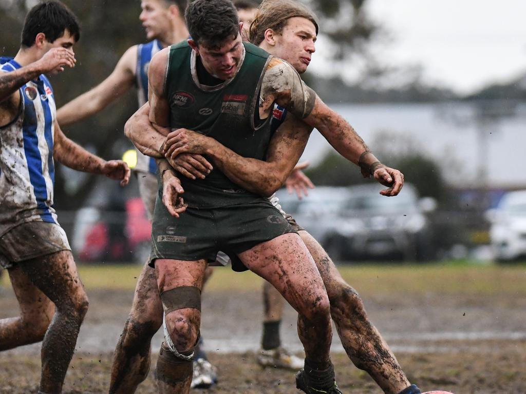 Macleod and Greensborough slog it out in the Northern Football League. Pictures: Nathan McNeill.