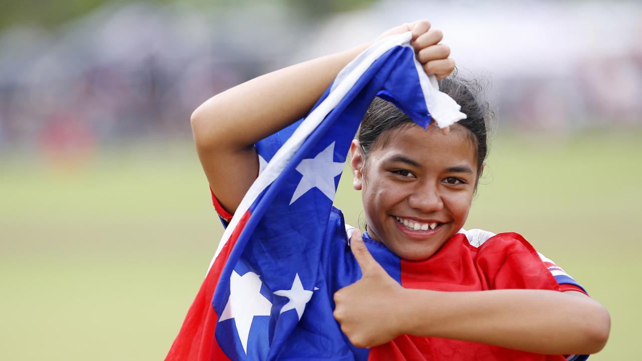 Ve'a Tavita proudly wears the Samoan flag. Pictures: John Appleyard