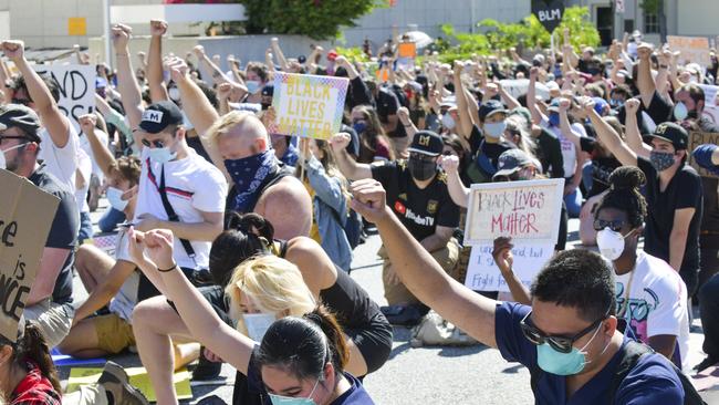 Protesters raise fists in solidarity in Glendale, California. Picture: AFP