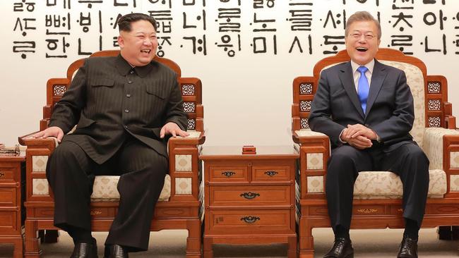 North Korea's leader Kim Jong-un, left, talking with South Korea's President Moon Jae-in in the truce village of Panmunjom. Picture: AFP Photo/KCNA via KNS