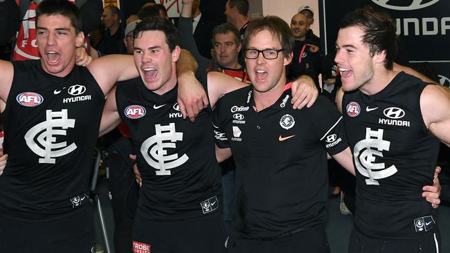 Carlton coach David Teague joins Matthew Kreuzer, Levi Casboult and Lachie Plowman to sing the song. Picture: Getty Images