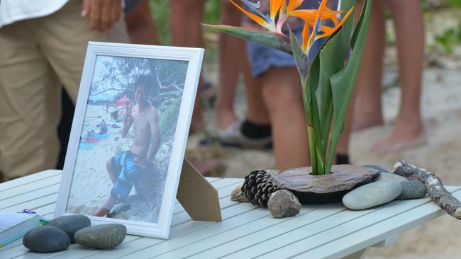 People gather at Shelly Beach, Ballina this morning to pay their respects for deceased Japanese surfer Tadashi Nakahara who tragically died last week following a shark attack Photographer - Brian Pamphilon