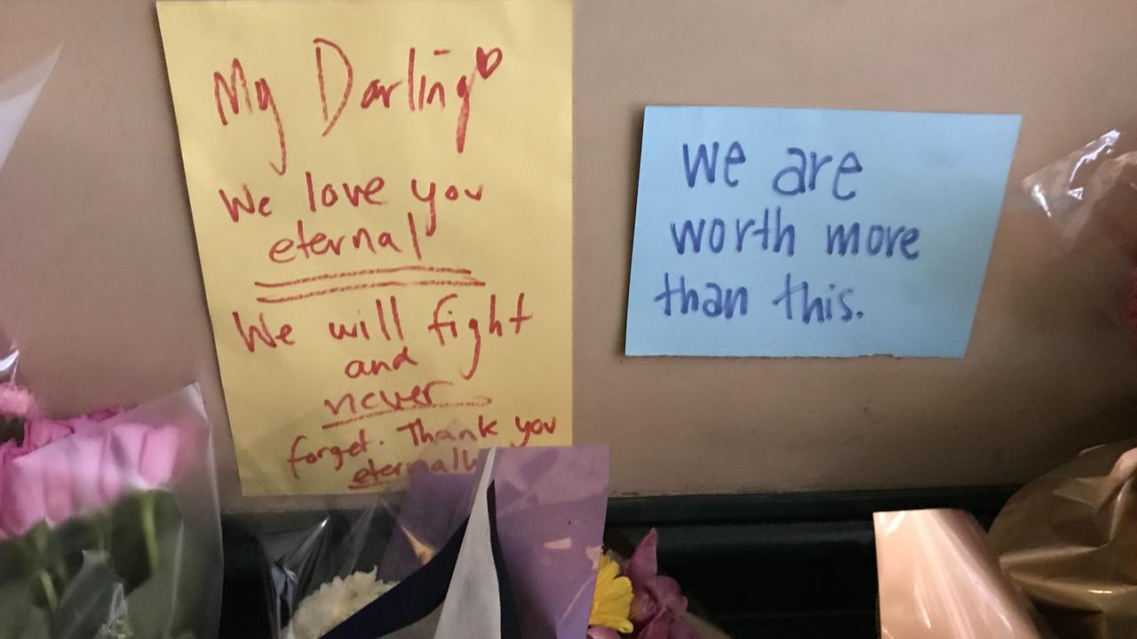 Flowers and handwritten notes left at the scene of Michaela Dunn’s alleged murder on Clarence Street, Sydney. .