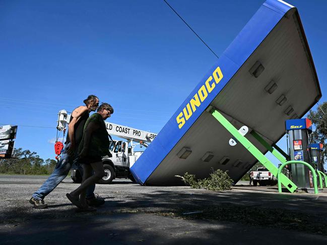 TOPSHOT - A rooftop of a Sunoco gas station destoyed by Hurricane Helene after making landfall is seen in Perry, Florida, on September 27, 2024. Hurricane Helene weakened on September 27 hours after it made landfall in the US state of Florida, with officials warning the storm remained "extremely dangerous" as it surged inland, leaving flooded roads and homes in its wake. (Photo by Chandan Khanna / AFP)