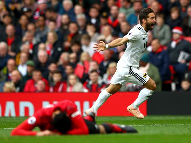 MANCHESTER, ENGLAND - SEPTEMBER 22: Joao Moutinho of Wolverhampton Wanderers celebrates after scoring his team's first goal during the Premier League match between Manchester United and Wolverhampton Wanderers at Old Trafford on September 22, 2018 in Manchester, United Kingdom.  (Photo by Matthew Lewis/Getty Images)