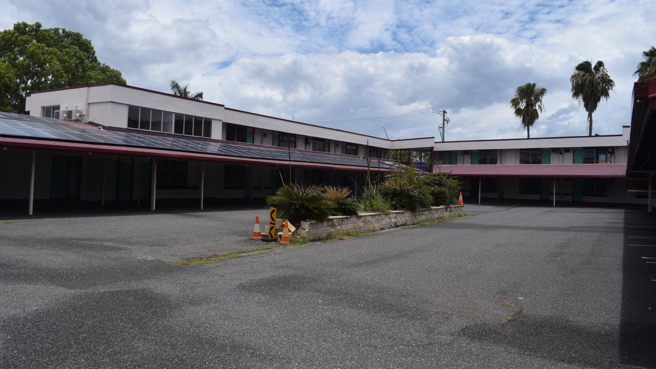 Ambassador Motel in an abandoned and overgrown state in late December 2023.