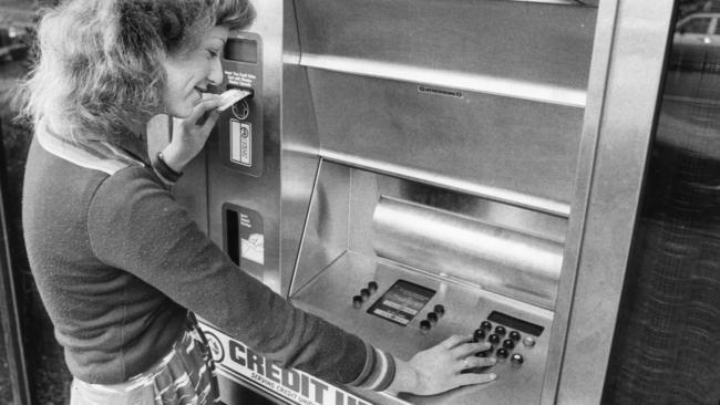 Jenine Newman, of Plympton Park, making use of the automated teller machine installed at the Police Association Credit Union in September 1980.