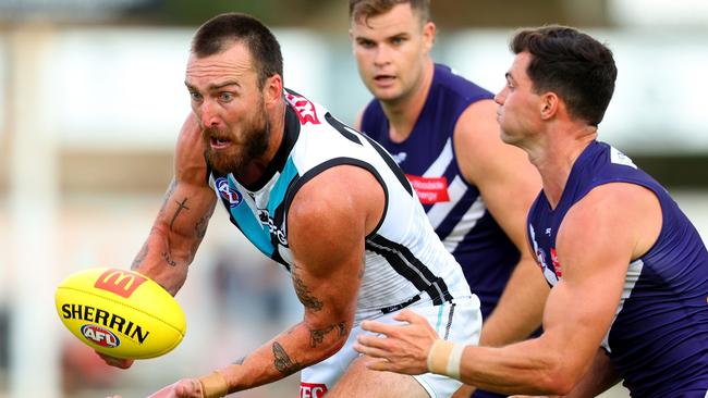 PERTH, AUSTRALIA - MARCH 02: Charlie Dixon of the Power handballs the ball away during the AFL Practice Match between the Fremantle Dockers and the Port Adelaide Power at Fremantle Oval on March 02, 2023 in Perth, Australia. (Photo by James Worsfold/AFL Photos/via Getty Images)