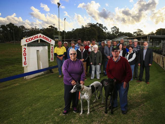 Coonamble locals stand on their the Greyhound track opposing Mike Baird's decision to ban racing / <b><a contentType="text" href="http://www.dailytelegraph.com.au/news/nsw/greyhound-ban-coonamble-towns-carnival-would-be-killed-off-by-bairds-action/news-story/5228dcd467138a5ad2372c1776ca2c39" shape="rect" target="_blank" title="www.dailytelegraph.com.au">READ THEIR STORY</a></b> / Picture: Dylan Robinson