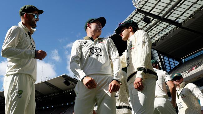 Marnus Labuschagne (centre) as Australia prepares to field on the final day at the MCG, with India set 340 to win. Picture: Martin Keep / AFP