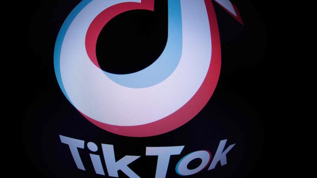 This photograph taken with a fish-eye lens in Paris on March 1, 2023 shows the social media application logo TikTok. - The European Parliament has told staff on March 1, 2023 to purge TikTok from devices used for work because of data protection concerns, after similar moves by the EU's main governing bodies last week. (Photo by JOEL SAGET / AFP)