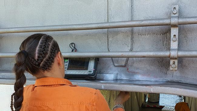 A Department of Transport and Roads worker conducting ultrasonic testing on a girder on the Barron River bridge. Picture: TMR