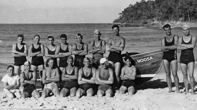 Noosa Heads Surf Life Saving Club members beside the club's first boat, circa 1950.