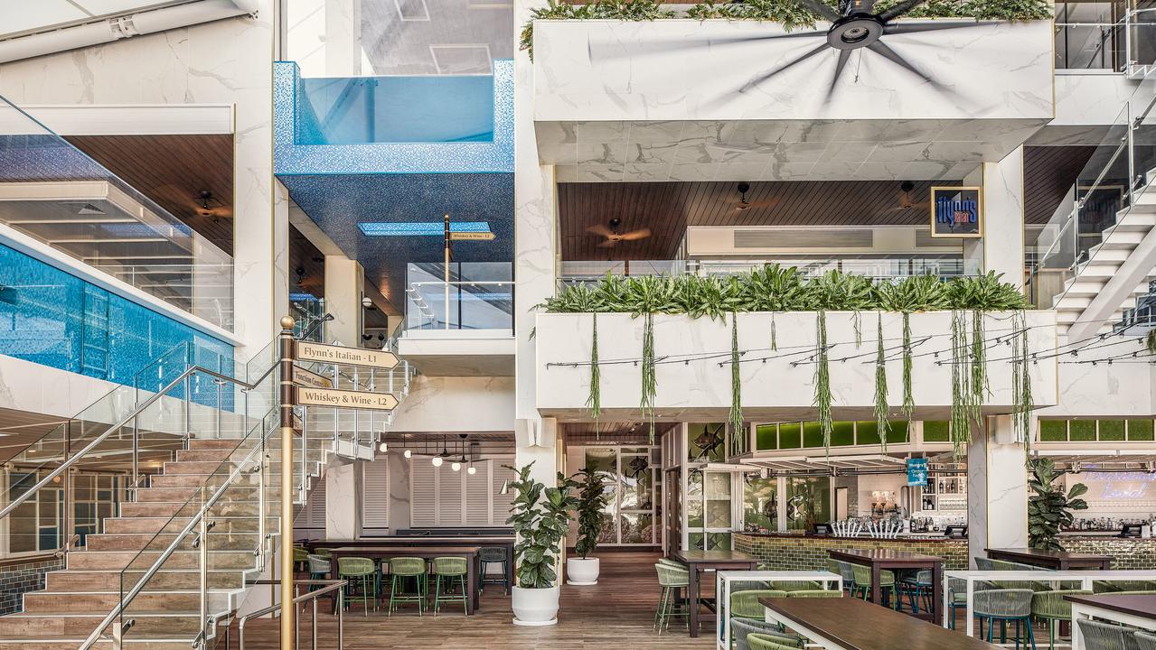 The two glass bottom pools of Crystalbrook Flynn visible in its dining precinct.