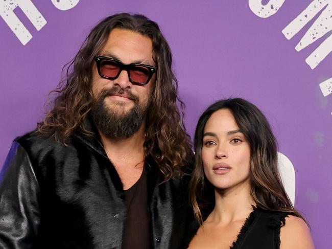 NEW YORK, NEW YORK - FEBRUARY 14: (L-R) Jason Momoa and Adria Arjona attend SNL50: The Homecoming Concert at Radio City Music Hall on February 14, 2025 in New York City.  (Photo by Dia Dipasupil/Getty Images)