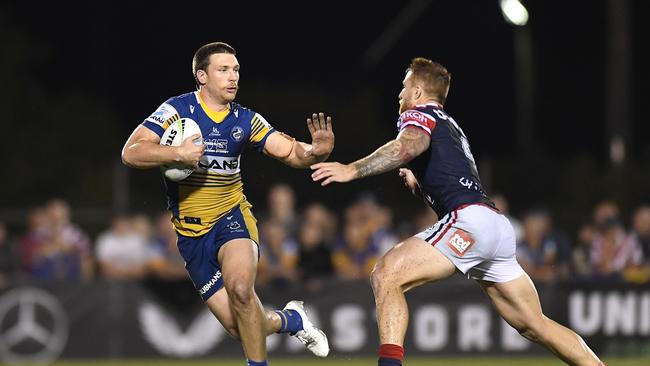 Tom Opacic of the Eels takes on Adam Keighran of the Roosters during the round 20 NRL match between the Sydney Roosters and the Parramatta Eels at BB Print Stadium, on July 29, 2021, in Mackay, Australia. Picture: Albert Perez – Getty Images