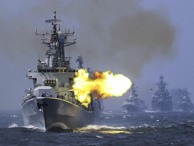 FILE -In this file photo taken Saturday, May 24, 2014, China's Harbin (112) guided missile destroyer takes part in a week-long China-Russia "Joint Sea-2014" navy exercise at the East China Sea off Shanghai, China. Double digit annual percentage increases in China’s defense budget have been fueling a top-to-bottom modernization drive that has brought in new equipment and vast improvements in living conditions for the People’s Liberation Army’s 2.3 million members.(Color China Photo via AP, File) CHINA OUT