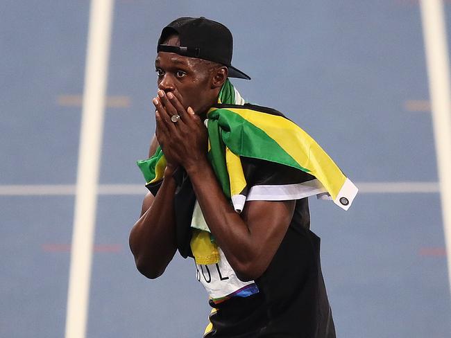 Usain Bolt celebrates in lane 4 after winning the Gold medal for Jamaica in the MenÕs 4 x 100m Relay Final during day 14 of the Rio 2016 Olympic Games. Picture: Brett Costello