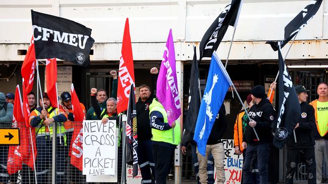 CFMEU members blocking Cross River Rail workers from entering the Roma Street station worksite in Brisbane on Tuesday. Picture: David Clark