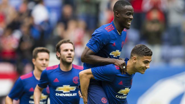 Manchester United midfielder Andreas Pereira celebrates with Eric Bailly and Juan Mata.