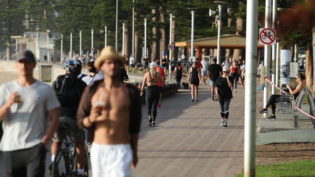 People out and about, exercising and swimming on the Corso and Manly Beach in Manly. Social Isolation Covid-19 measures are expected to stay in place for the next 90 days. Picture Rohan Kelly