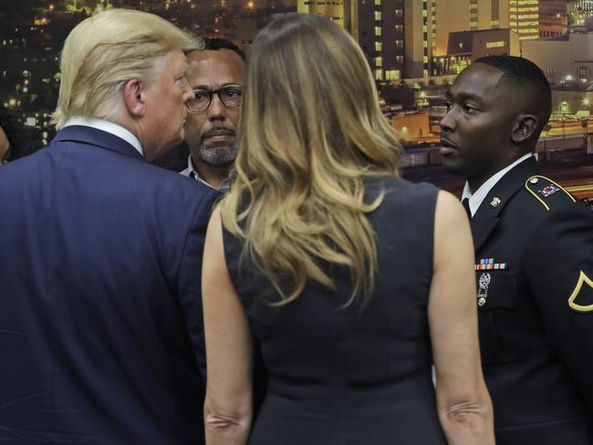 President Donald Trump and first lady Melania Trump talk with Army Pfc. Glendon Oakley, right, as he speaks as they visit the El Paso Regional Communications Center. Picture: AP