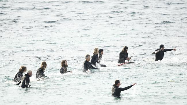 People in the water during a ceremony in memory of Alex “Chumpy” Pullin in Torquay, Victoria. Photo: NCA NewsWire / Daniel Pockett