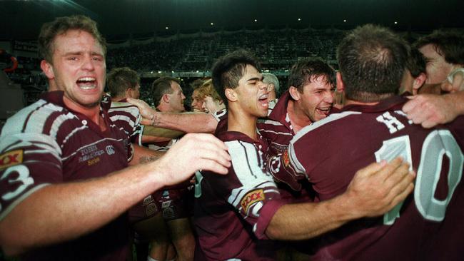 Moore (left) and his Queensland teammates celebrate the series victory in 1995.