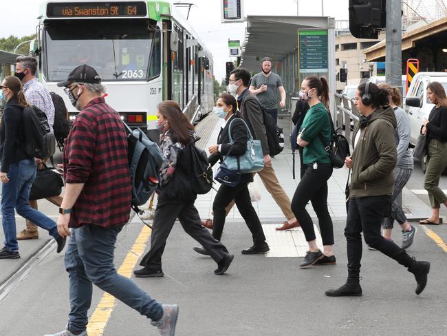 Traffic and workers return to Melbourne CBD after 50% of workers are allowed back to work after the COVID restrictions. People on Swanston Street. Monday, January 18, 2020. Picture: David Crosling