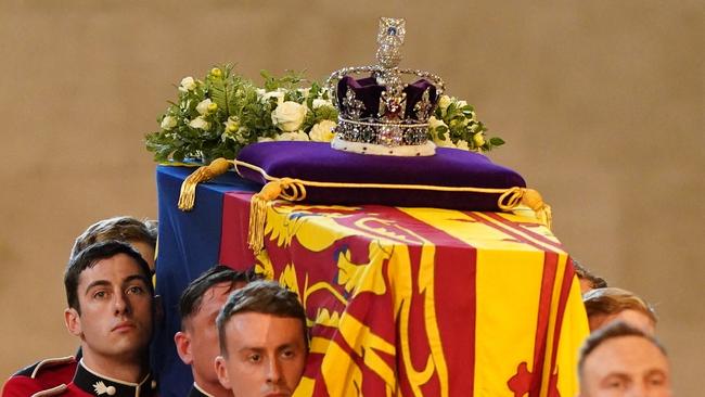 The Impreial Crown, orb and sceptre will be removed in the final moments at St George’s Chapel. Picture: Jacob King / POOL / AFP