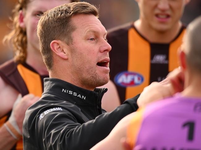 CANBERRA, AUSTRALIA - AUGUST 04: Sam Mitchell, Senior Coach of the Hawks speaks to players during the round 21 AFL match between Greater Western Sydney Giants and Hawthorn Hawks at Manuka Oval, on August 04, 2024, in Canberra, Australia. (Photo by Morgan Hancock/Getty Images)