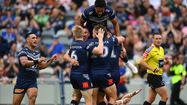 Cowboys celebrate a Scott Drinkwater try during the round one NRL match between the North Queensland Cowboys and the Canberra Raiders at Qld Country Bank Stadium on March 04, 2023 in Townsville, Australia. (Photo by Albert Perez/Getty Images)