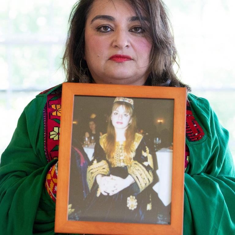 Bahar Jalali holds a photograph of herself when she was younger. Picture: Saul Loeb/AFP