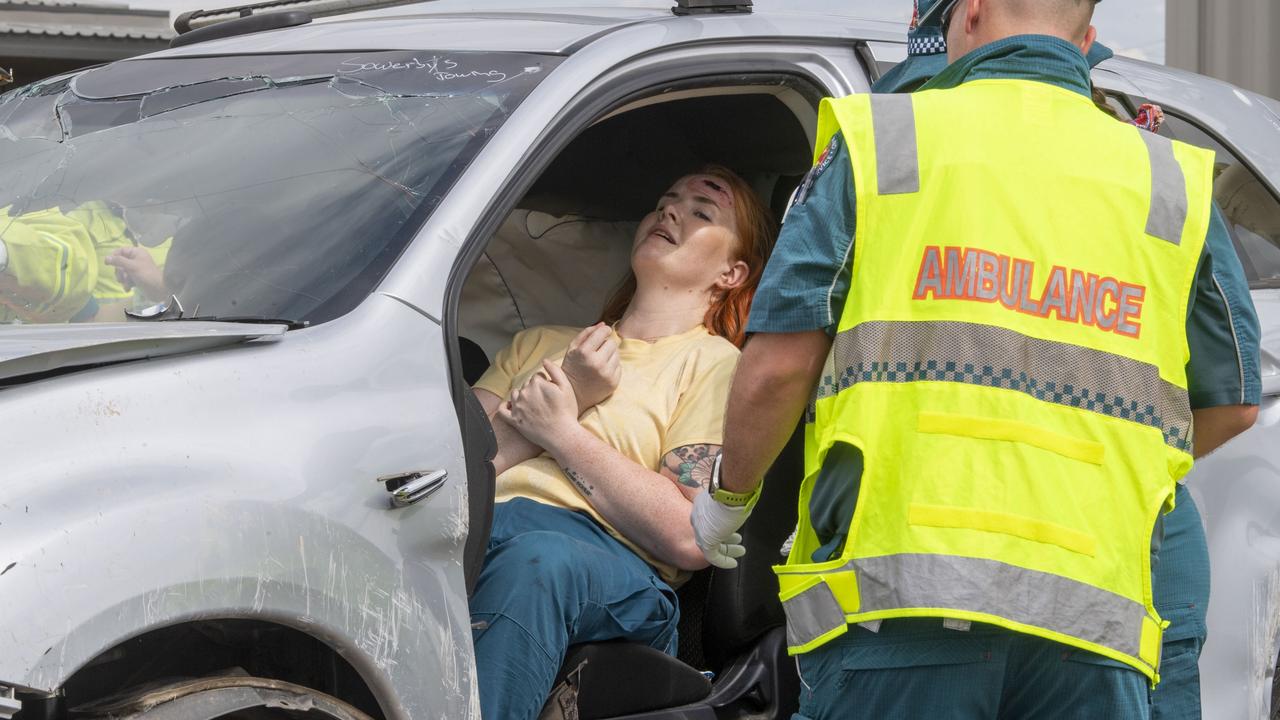 Zoe Miller-Starr plays a victim during the trauma response training exercise at the Queensland Fire and Emergency Services Charlton Station. Picture: Nev Madsen.