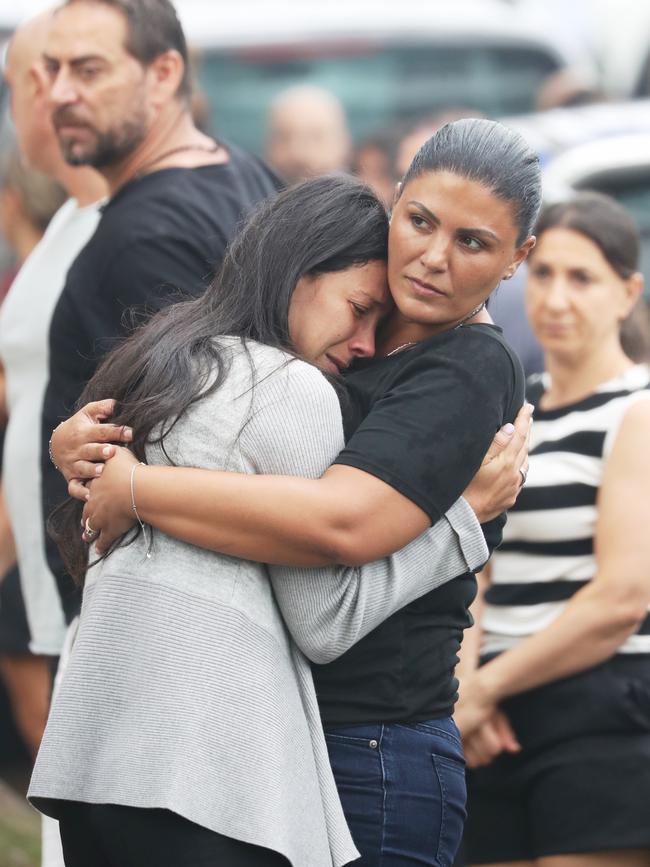 She was comforted by friends and family. Picture: John Grainger