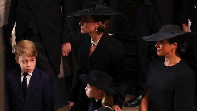 The Princess of Wales with her children Prince George and Princess Charlotte, and Meghan Markle. Picture: AFP