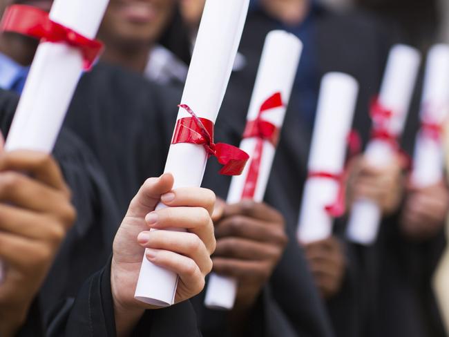 Group of graduates holding diplomas. Picture: iStock