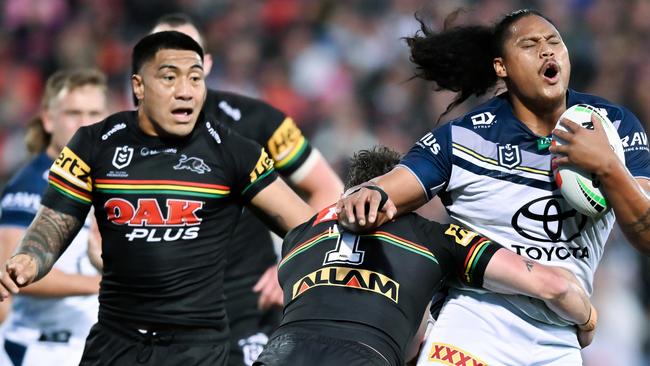 Luciano Leilua is tackled by Dylan Edwards as the Panthers crushed the Cowboys’ finals hopes. (Photo by Izhar Khan/Getty Images)