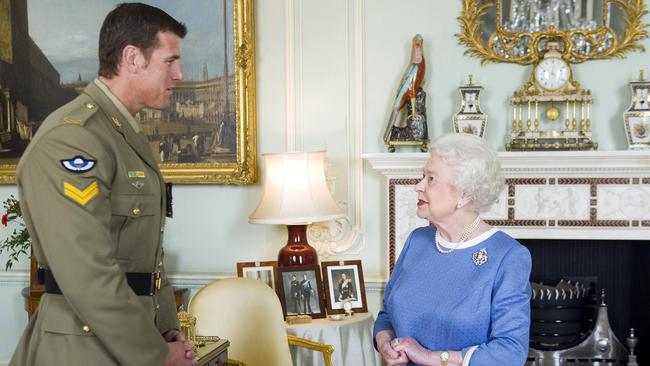 Mr Roberts-Smith meeting the Queen after he was awarded the Victoria Cross.