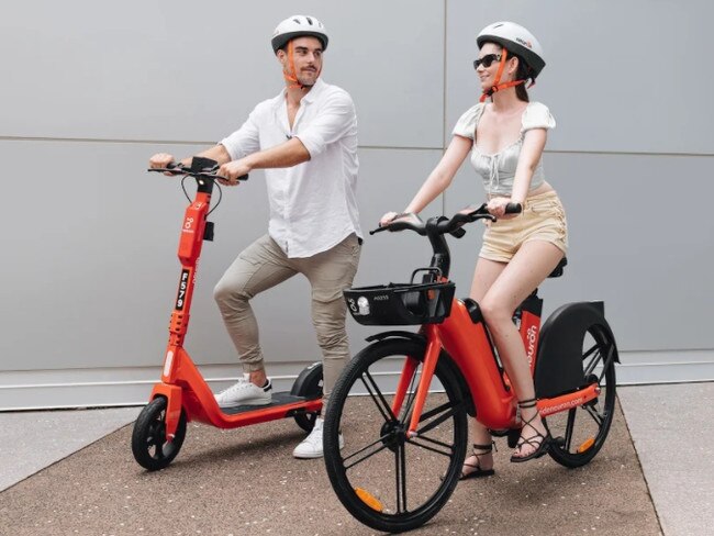 Robbie Turnbull and Veruschka Warde enjoy the Neuron eScooter and eBike, with 150 of each to be added to the existing fleet of eScooters across Darwin early next month. Picture: Supplied