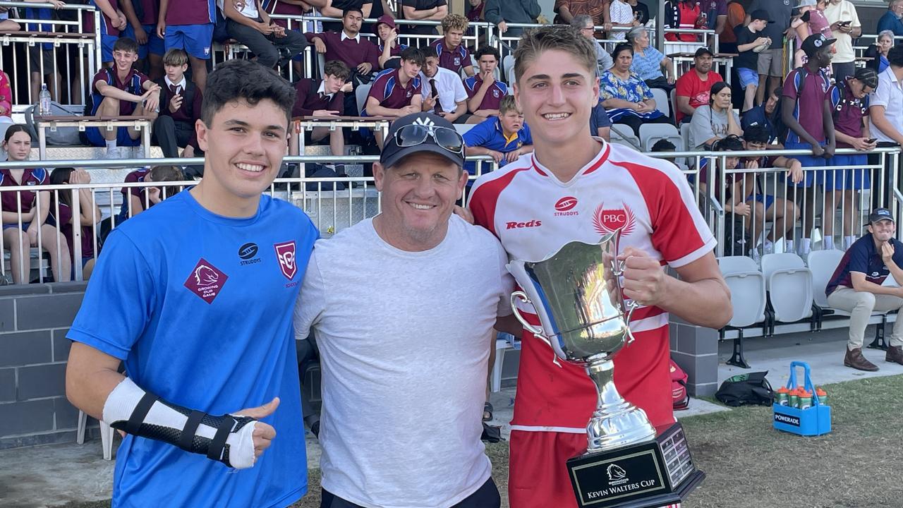 Palm Beach Currumbin player Marley McLaren, left, with Taj lateo with Broncos legend Kevin Walters after the school won the Walters Cup.