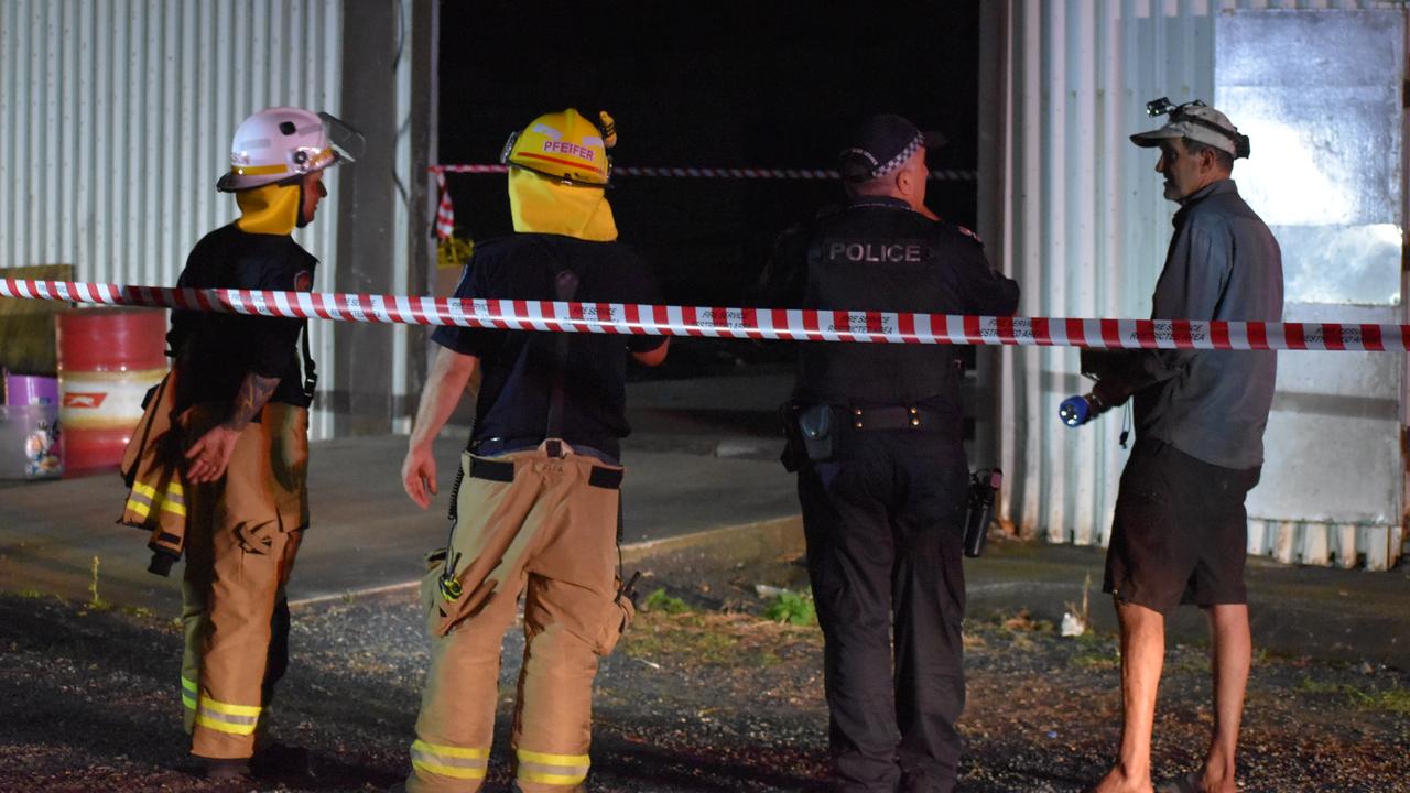 Firefighters and police assess the scene of a building collapse along River Street in Mackay CBD. A 15m by 15m part of the floor has fallen into the Pioneer River. Picture: Rae Wilson