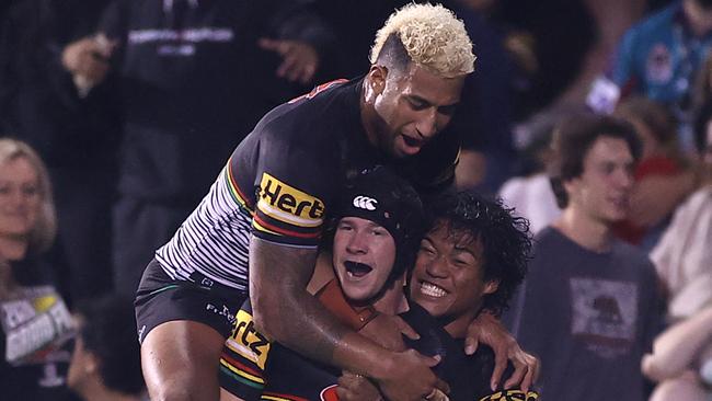 SYDNEY, AUSTRALIA - APRIL 09:  Matt Burton of the Panthers celebrates with team mates after scoring a try during the round five NRL match between the Penrith Panthers and the Canberra Raiders at BlueBet Stadium on April 09, 2021, in Sydney, Australia. (Photo by Mark Kolbe/Getty Images)