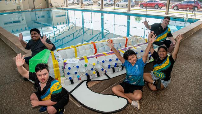 Henbury School students and Turtle-Time crew Christina Cantoria, Miley Lam, Jacob Gil, Owen Corpus, and Andrew Perry prepare their boat for the Beer Can Regatta, 2024. Picture: Pema Tamang Pakhrin